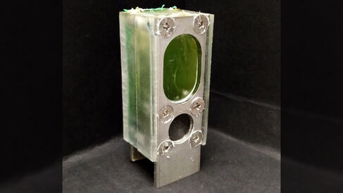 A container holding the blue-green algae that powered a microprocessor.