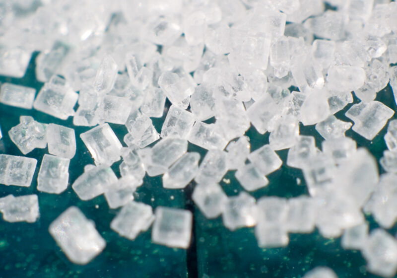 Magnification of grains of refined sucrose, the most common free sugar