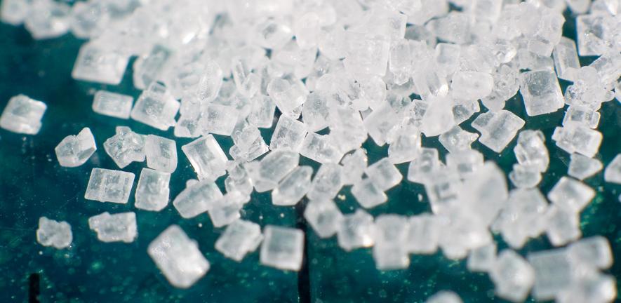 Magnification of grains of refined sucrose, the most common free sugar Magnification of grains of refined sucrose, the most common free sugar