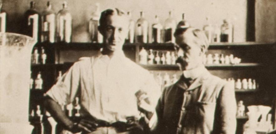 S.W. Cole and F.G. Hopkins with the first specimen of tryptophan, 1901
